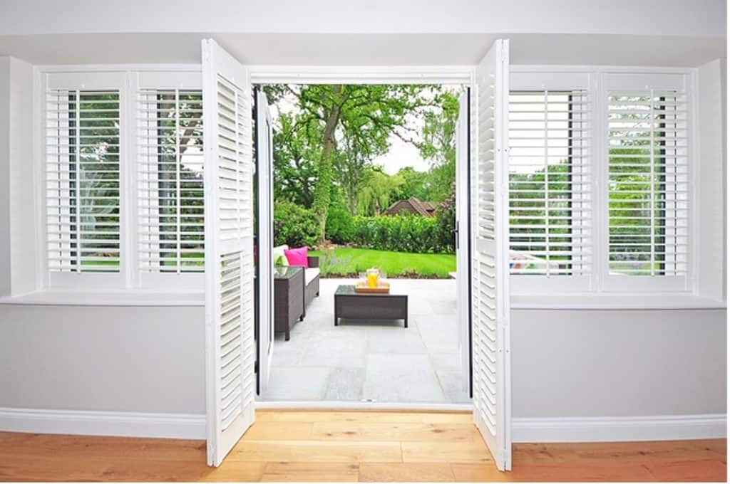 Inside view of white painted plantation shutters- for article how to paint shutters