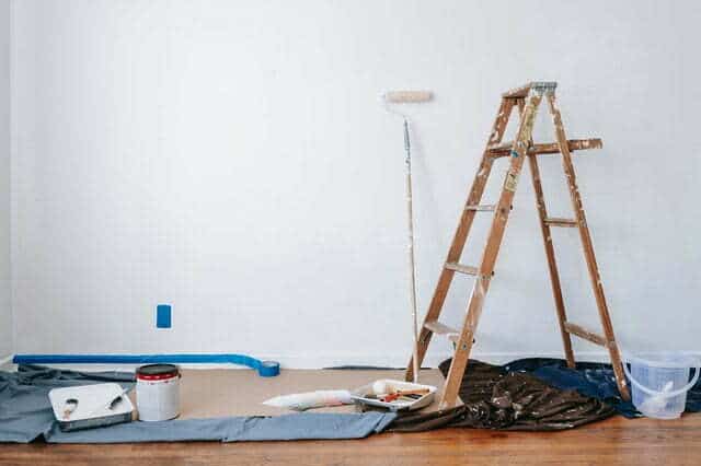 wooden ladder and paint materials for article how to paint over wallpaper